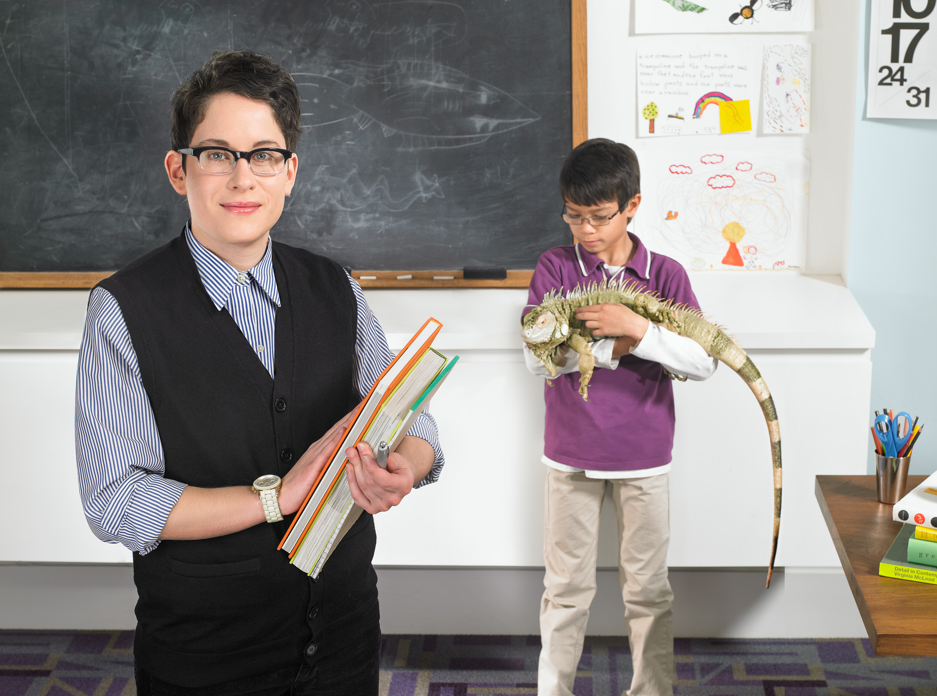 Teacher poses for photo in classroom