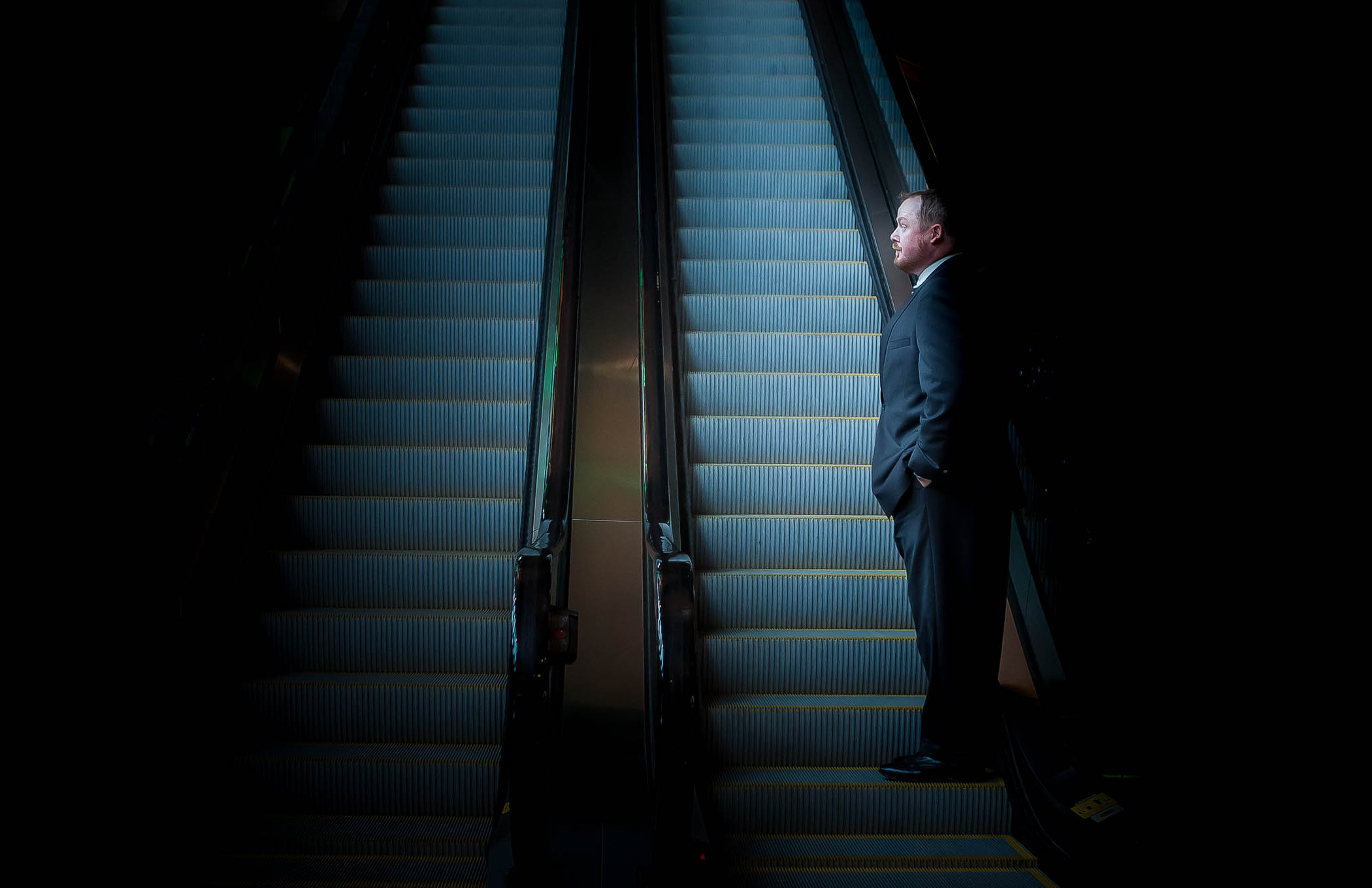 Businessman on escalator corporate travel in Atlanta